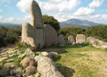 Known as "Tombe dei Giganti," the structures are characterized by large stone slabs arranged in a semi-circular fashion. Wikimedia Commons.