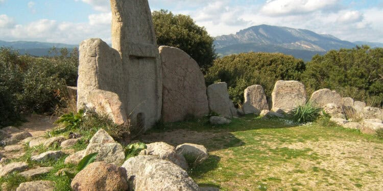 Known as "Tombe dei Giganti," the structures are characterized by large stone slabs arranged in a semi-circular fashion. Wikimedia Commons.