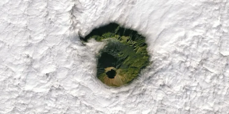 In 2022, as the Landsat 8 satellite passed overhead, the caldera at Mount Vesuvius' summit aligned perfectly with a circular break in the clouds, creating a breathtaking visual spectacle. (Image credit: NASA/Landsat/Joshua Stevens).