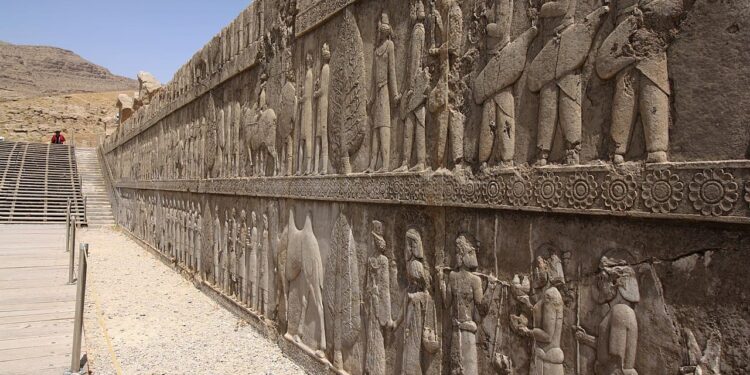 A depiction of Sogdian merchants carved into a relief at Persepolis. Credit: Blondinrikard Fröberg / Wikimedia Commons.