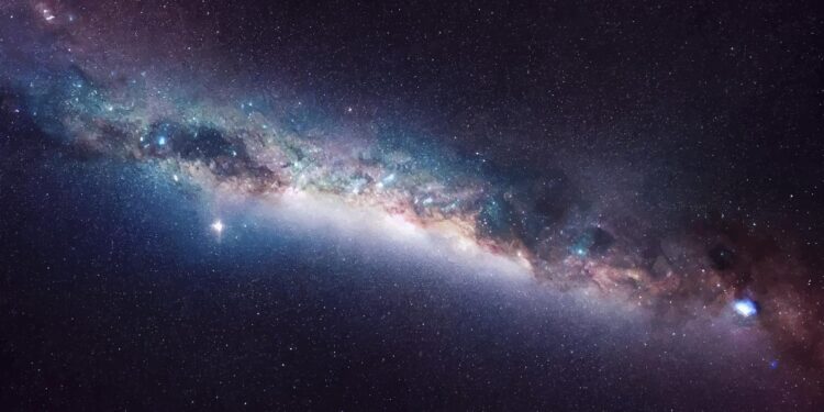 An artistic rendering of a distant galaxy. Yayimages/Curiosmos.