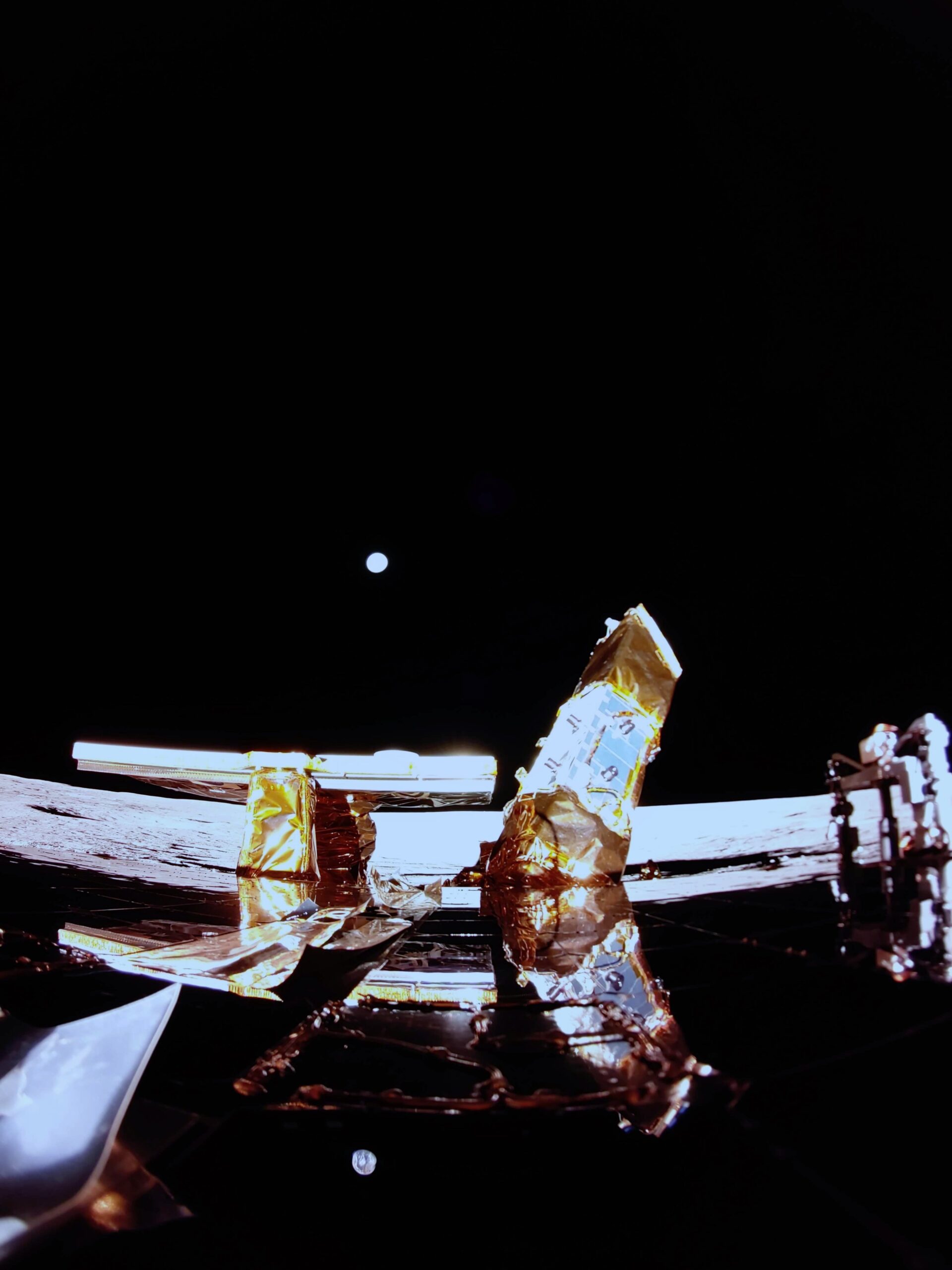 A breathtaking image from Firefly Aerospace’s Blue Ghost lander showcases the Moon’s surface with Earth rising on the horizon. The shot also features key components of the spacecraft, including its solar panel, the X-band antenna (left), and the LEXI payload (right), offering a remarkable view of the mission’s hardware against the vastness of space. Credit: Firefly Aerospace.