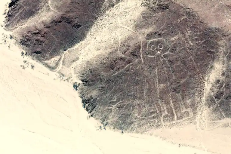 Aerial view of the Nazca “Astronaut” geoglyph on a desert hillside in southern Peru.