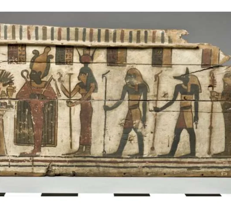 Ancient Egyptian painted coffin panel with figures and hieroglyphs