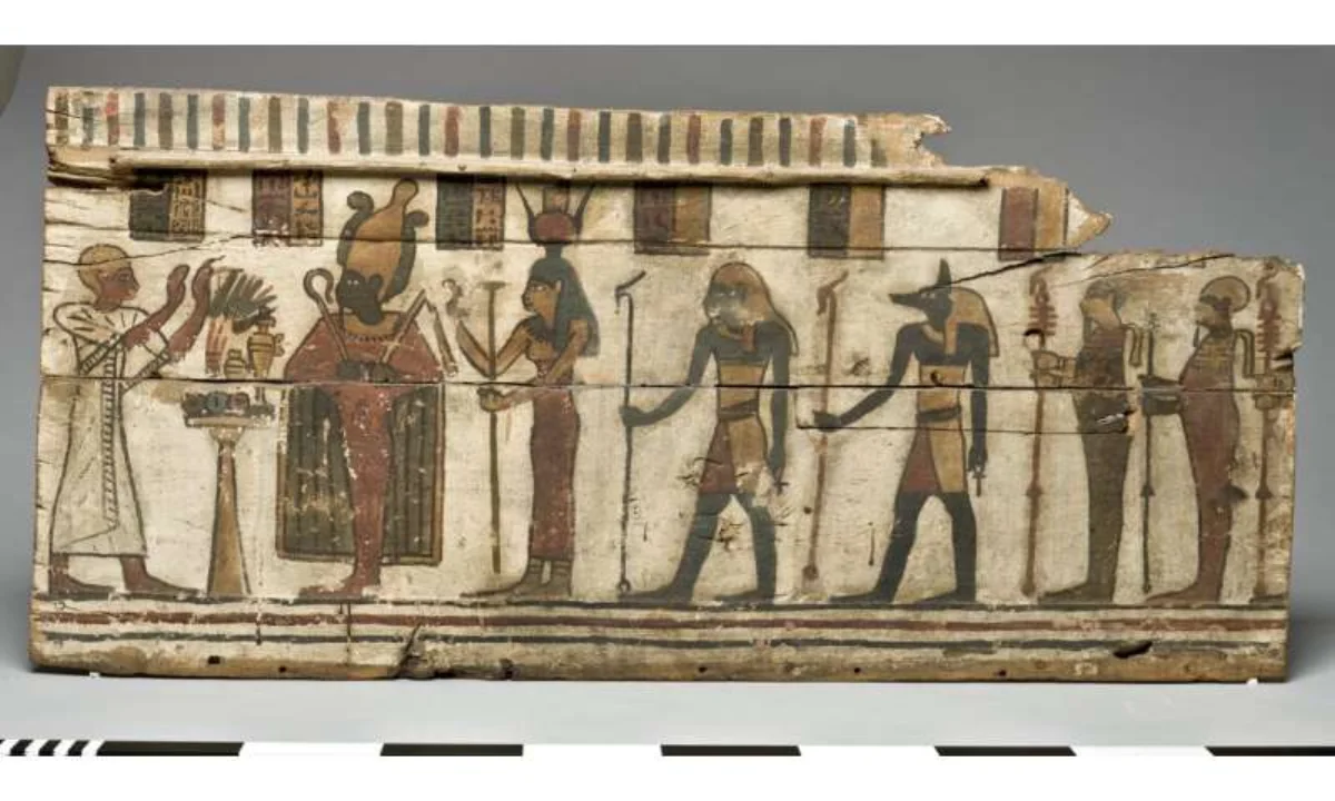 Ancient Egyptian painted coffin panel with figures and hieroglyphs