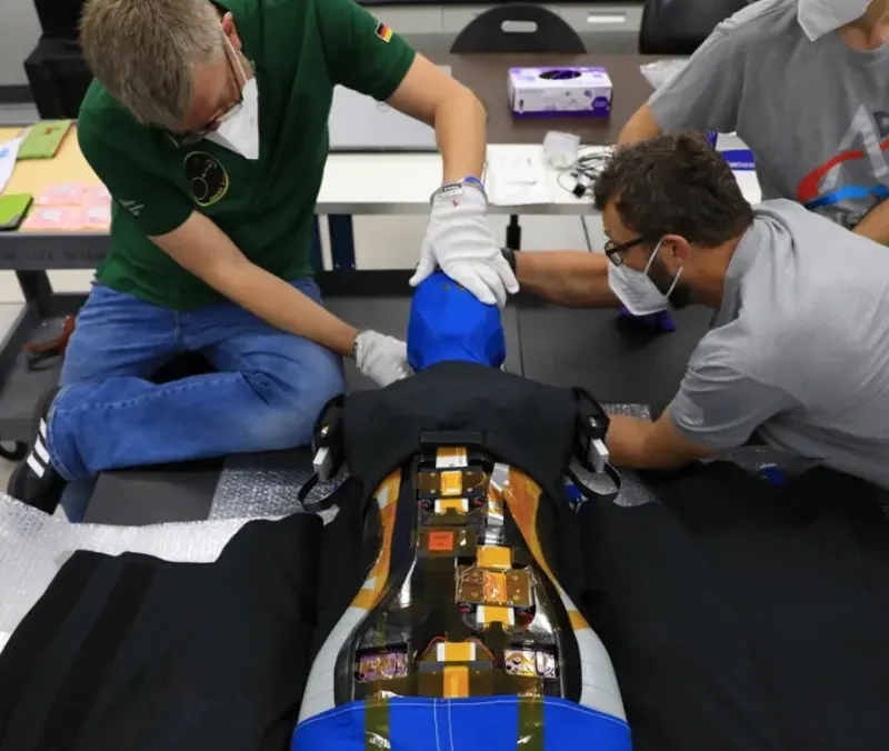 Technicians fitting the AstroRad radiation vest to the Zohar mannequin