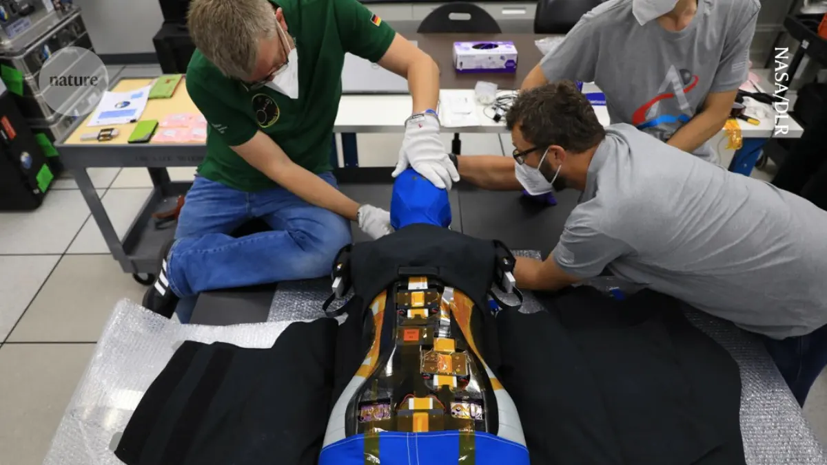 Technicians fitting the AstroRad radiation vest to the Zohar mannequin