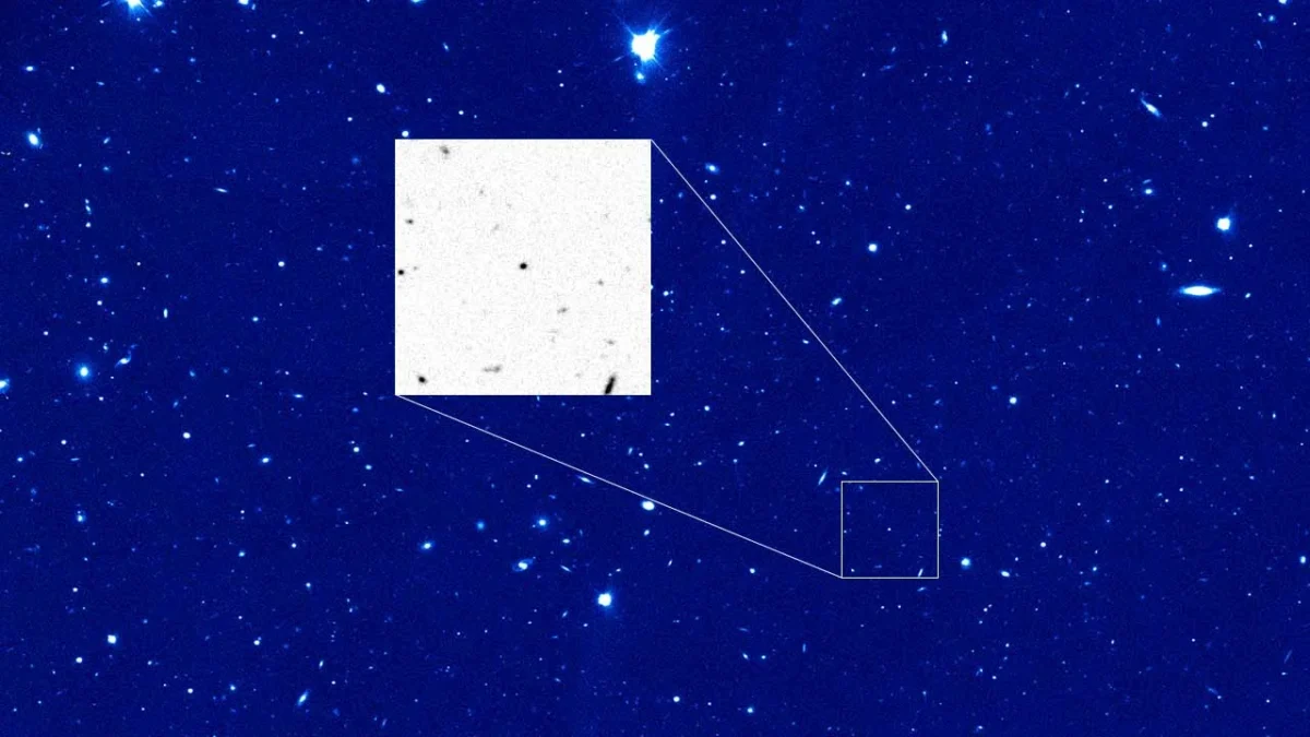 A star field with a small comet inset showing the nucleus of comet 28P