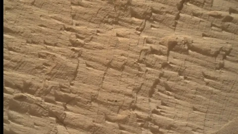 NASA Curiosity rover studying layered rocks near a geological boundary on Mars
