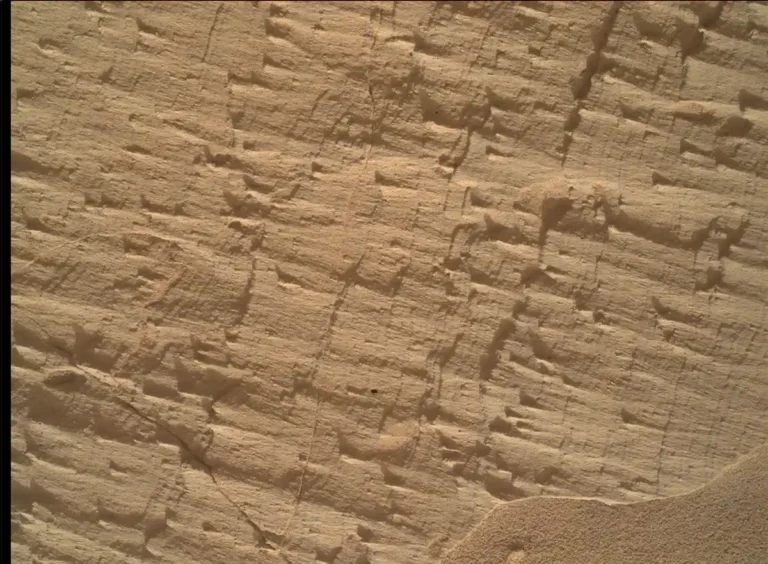 NASA Curiosity rover studying layered rocks near a geological boundary on Mars