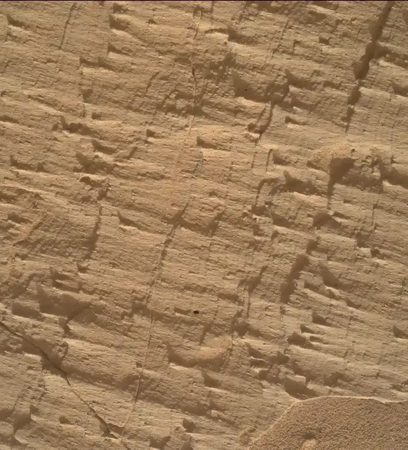 NASA Curiosity rover studying layered rocks near a geological boundary on Mars