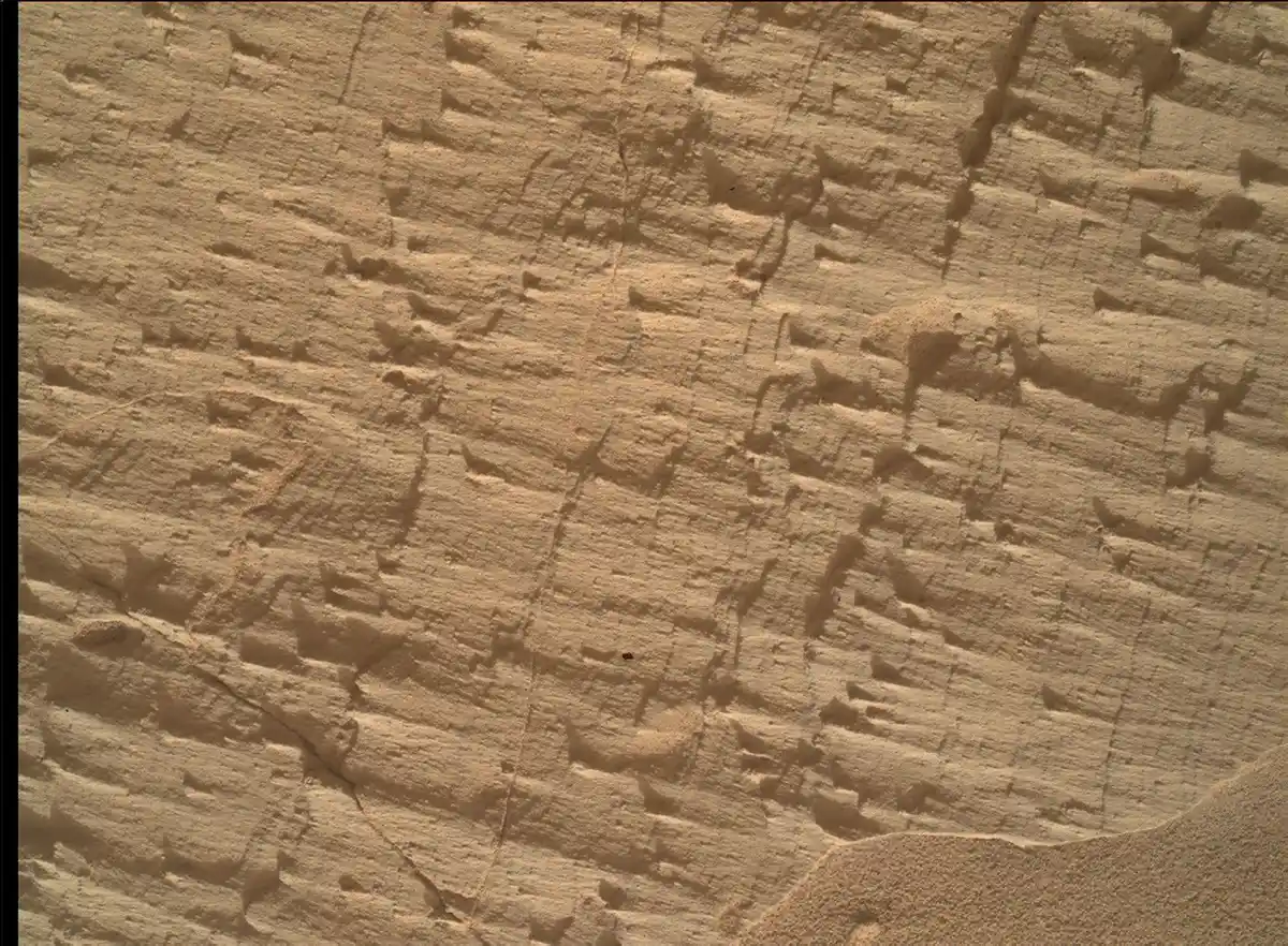 NASA Curiosity rover studying layered rocks near a geological boundary on Mars