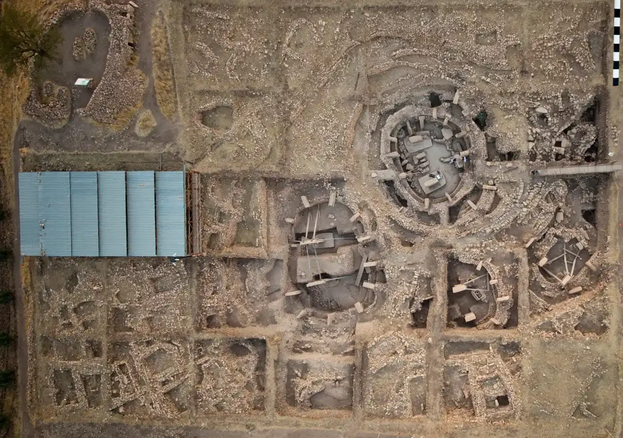Aerial view of Göbekli Tepe showing monumental enclosures and adjacent rectangular buildings