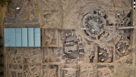 Aerial view of Göbekli Tepe showing monumental enclosures and adjacent rectangular buildings