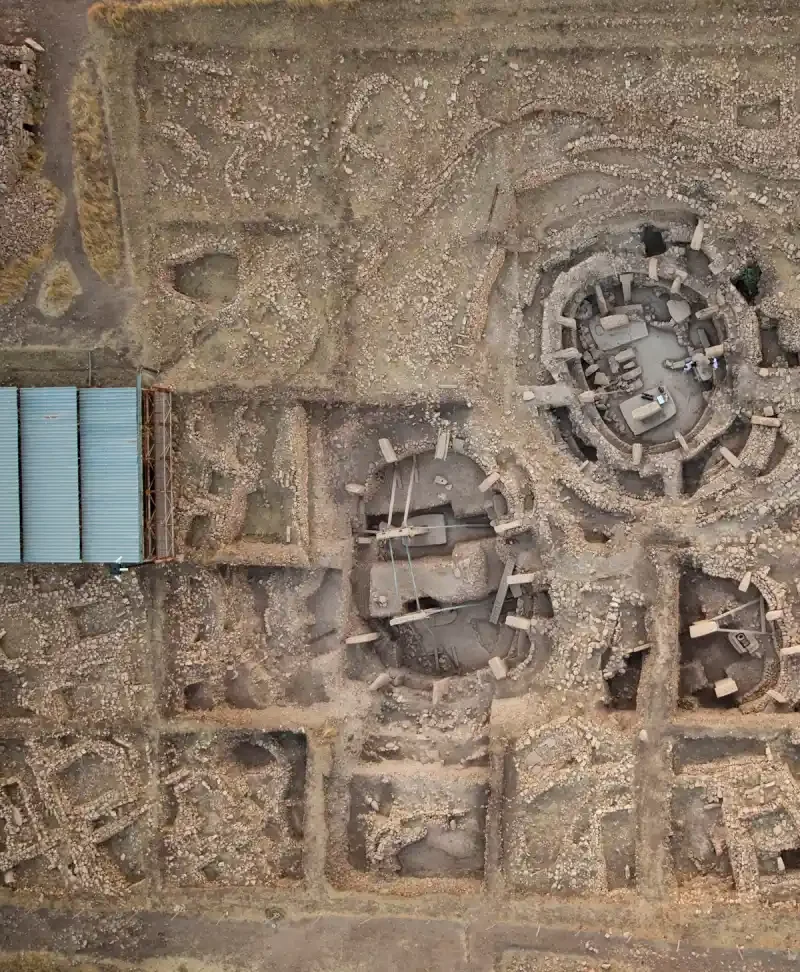Aerial view of Göbekli Tepe showing monumental enclosures and adjacent rectangular buildings