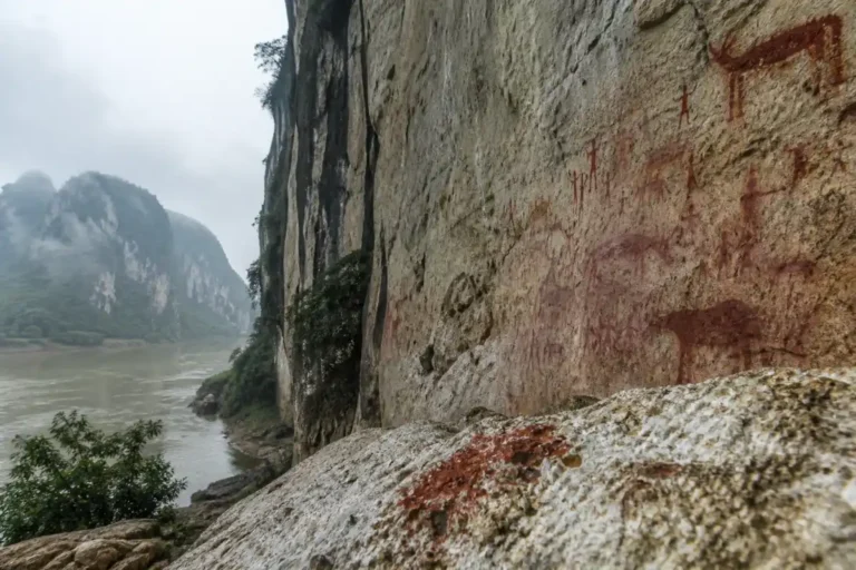 Red rock paintings on the limestone cliffs of Huashan in southern China