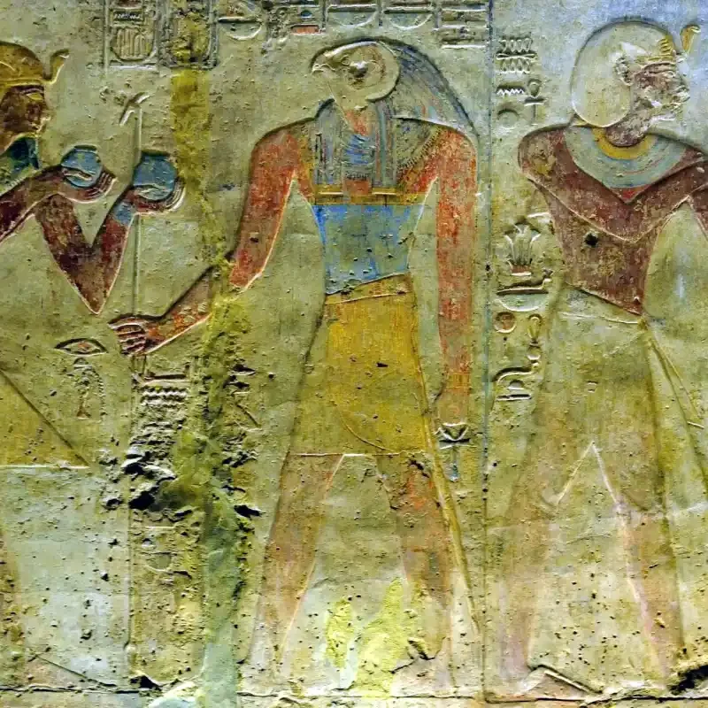 Ramesses II making an offering to Horus in an ancient Egyptian temple relief