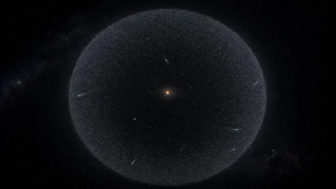 Editorial illustration of a distant shell of icy comet-like objects around the Solar System
