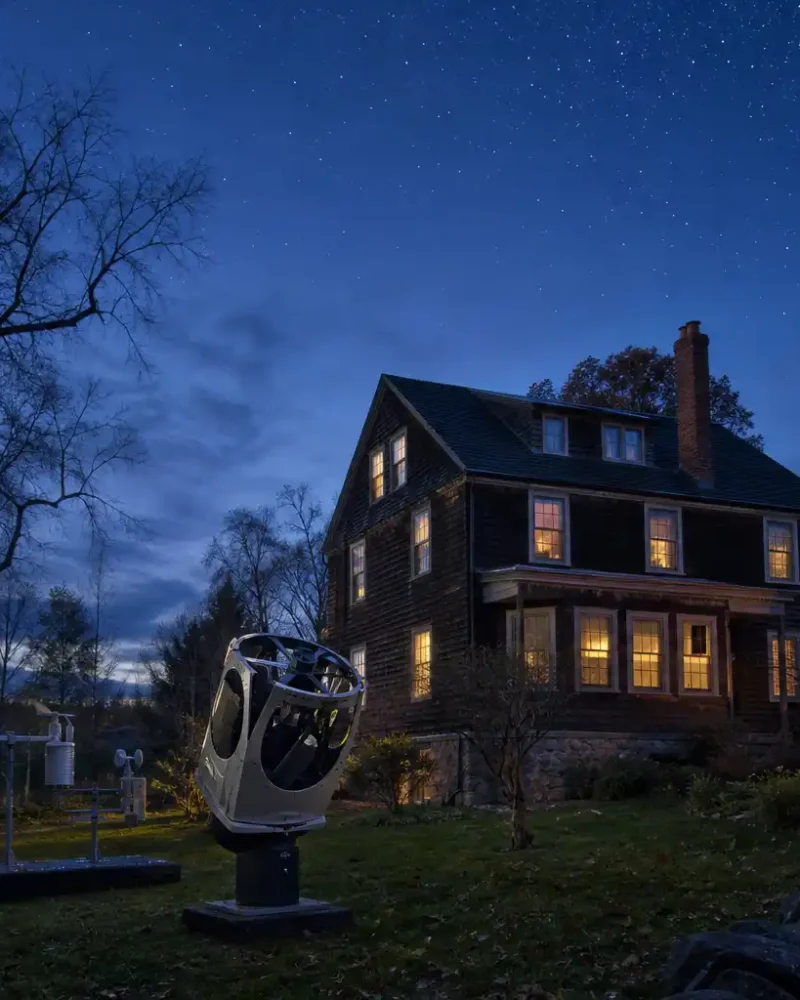 A telescope dome and observatory beside a house associated with astronomer Carl Sagan.