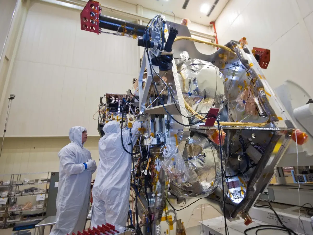 NASA engineers work on the electronics of a deep-space spacecraft