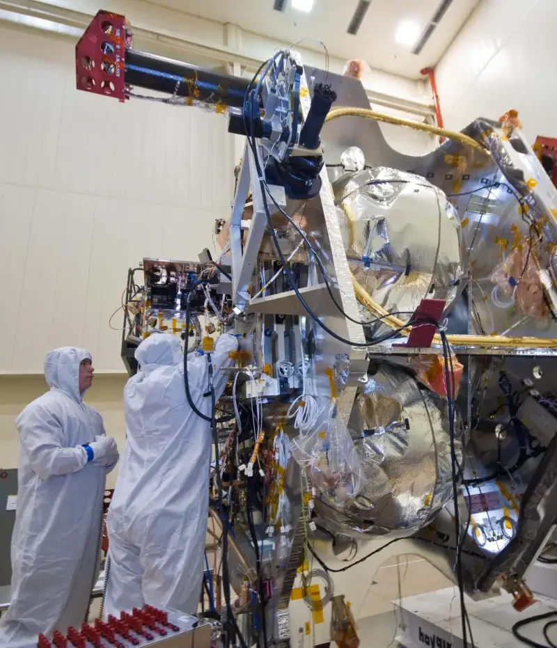 NASA engineers work on the electronics of a deep-space spacecraft
