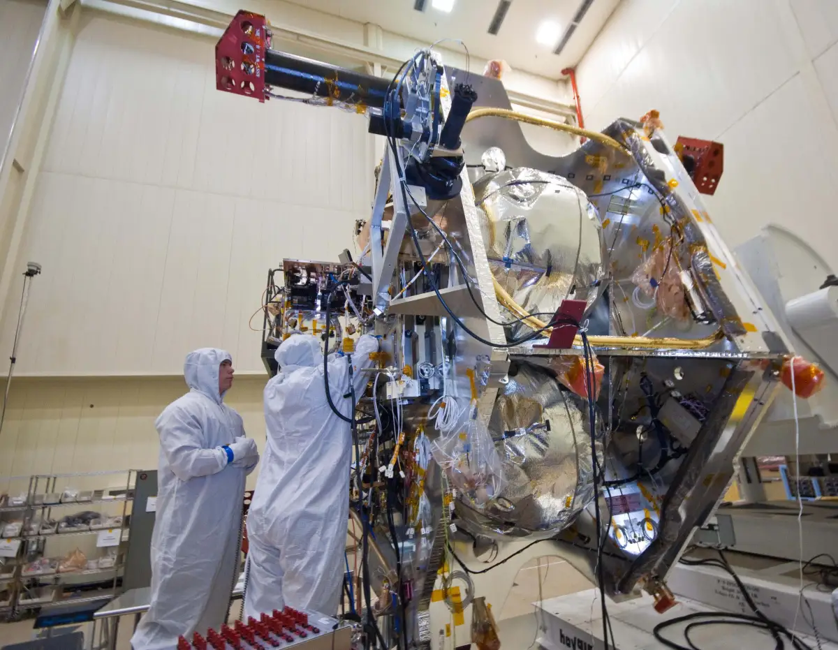 NASA engineers work on the electronics of a deep-space spacecraft