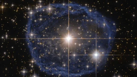 Hubble image of a glowing bubble of gas around an aging star