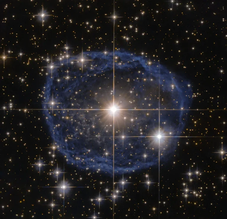 Hubble image of a glowing bubble of gas around an aging star