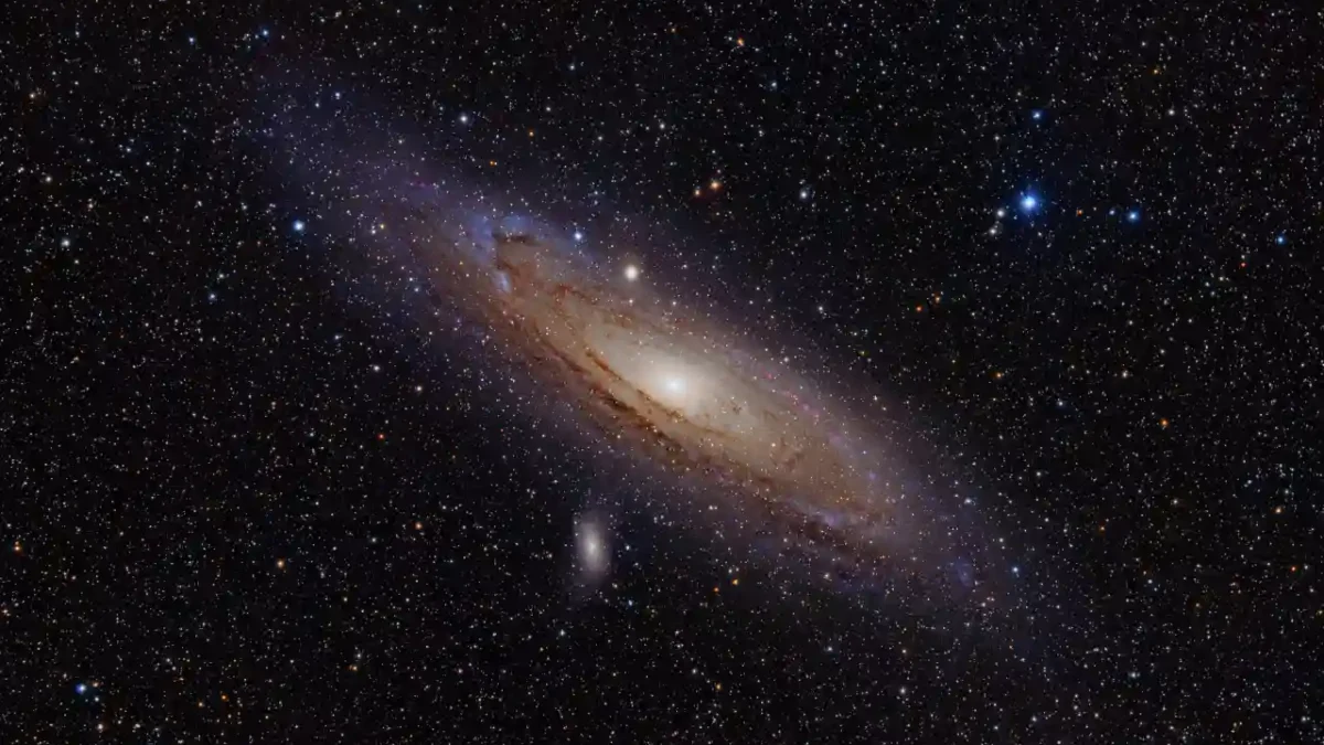The Andromeda Galaxy stretching across a dark field of stars