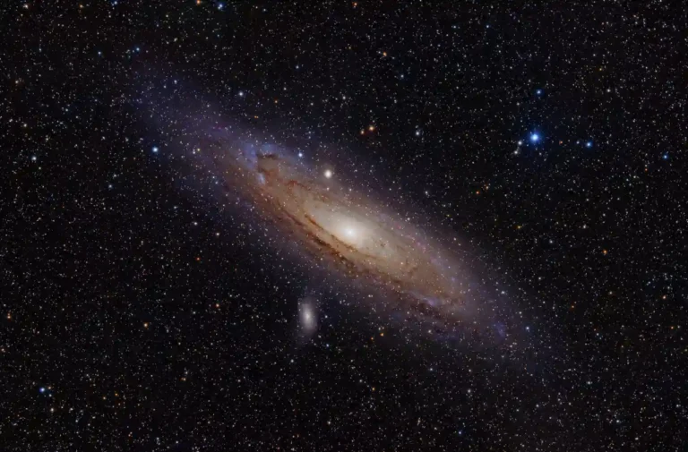 The Andromeda Galaxy stretching across a dark field of stars