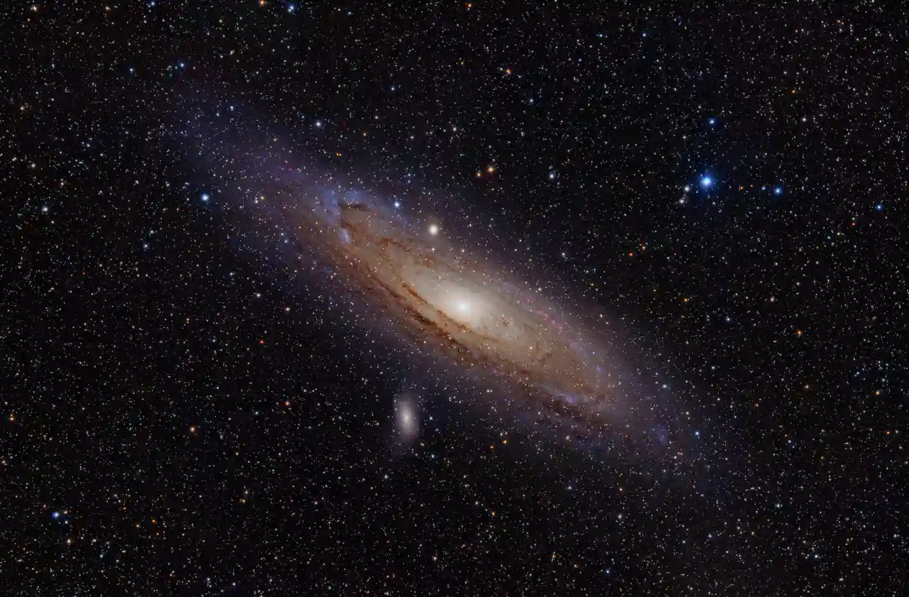 The Andromeda Galaxy stretching across a dark field of stars
