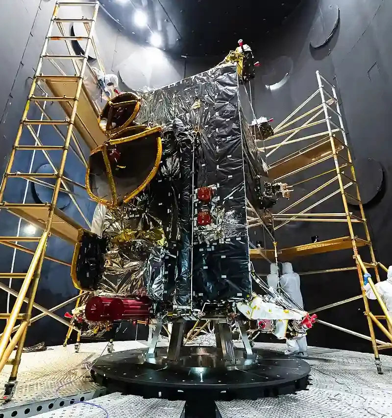 A spacecraft structure tested inside a thermal vacuum chamber