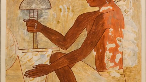 Facsimile of a seated Egyptian craftsperson holding a vertical drill over a stone vessel, from the tomb of Rekhmire.