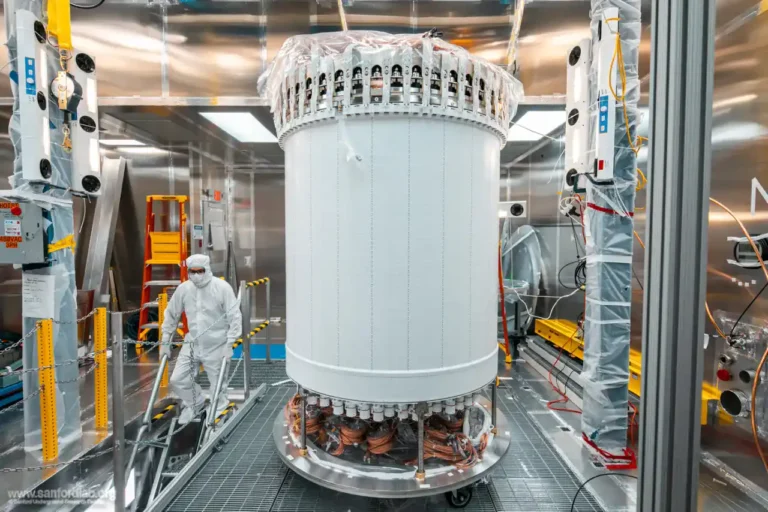 Researcher working beside the LUX-ZEPLIN dark-matter detector underground