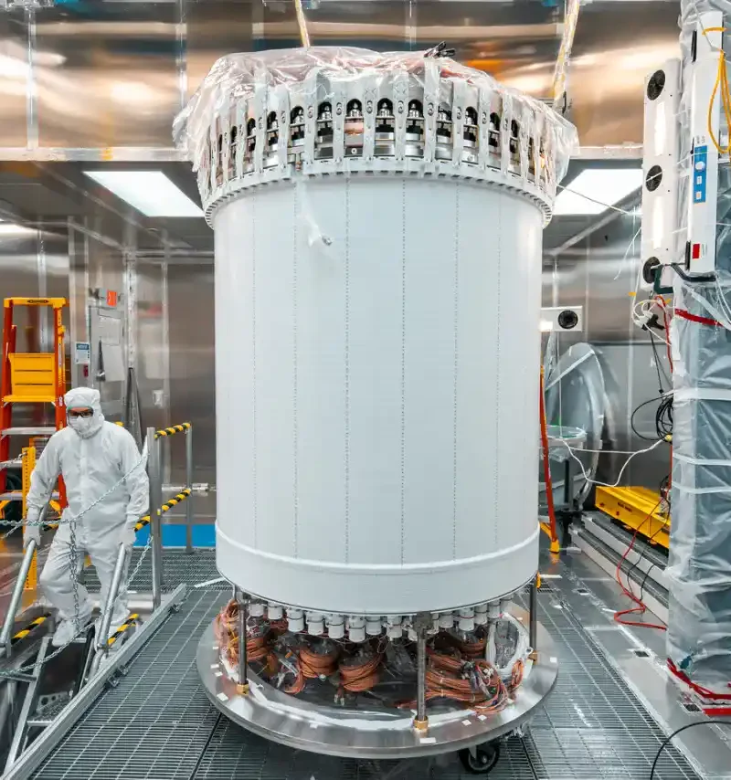 Researcher working beside the LUX-ZEPLIN dark-matter detector underground