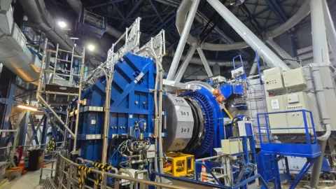 The MOONS spectrograph installed beside a telescope at ESO’s Very Large Telescope in Chile.