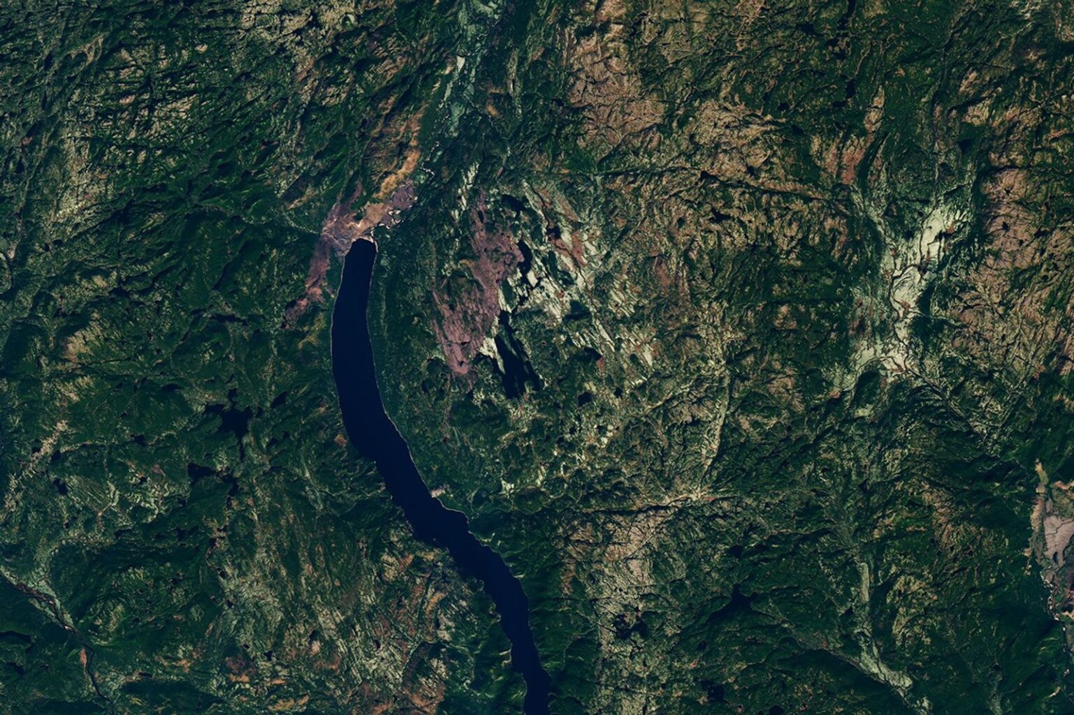 The circular Uhackatik impact structure in Quebec, with Lake Marsal near its centre, seen by Landsat 8.