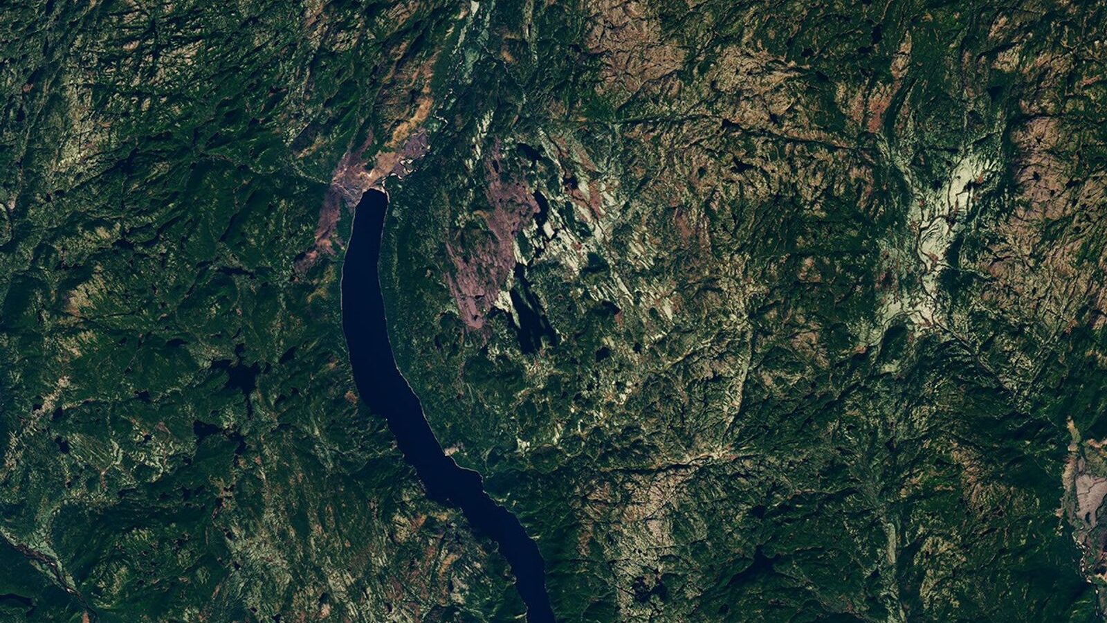 The circular Uhackatik impact structure in Quebec, with Lake Marsal near its centre, seen by Landsat 8.