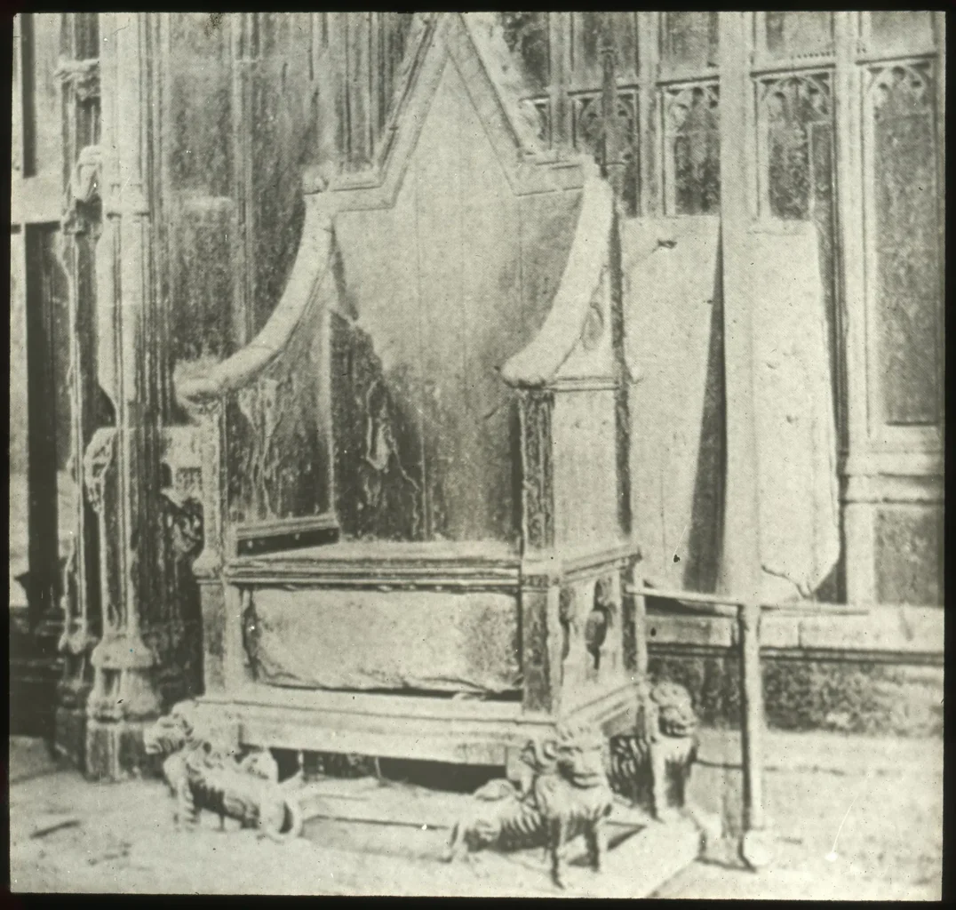 Historic photograph of the coronation chair and Stone of Scone at Westminster Abbey