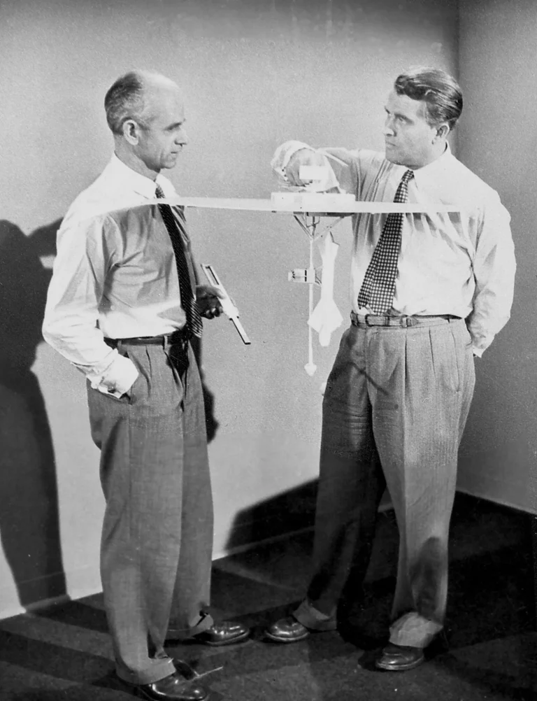 Wernher von Braun and Ernst Stuhlinger examining a model of a proposed Mars spacecraft