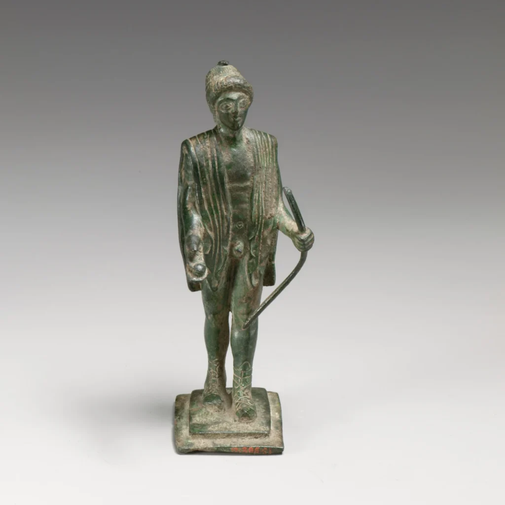 Ancient bronze statuette of Apollo holding a bow