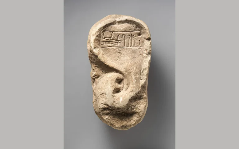 Stone votive ear of Ramessumerysutekh, with a carved inscription above the ear.