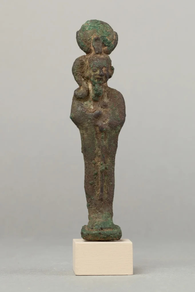 Metal statuette of Khonsu with a moon disk and sidelock of youth