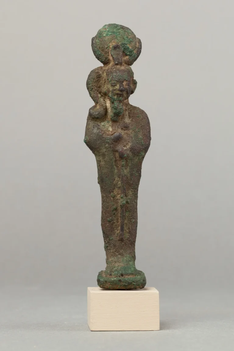 Metal statuette of Khonsu with a moon disk and sidelock of youth