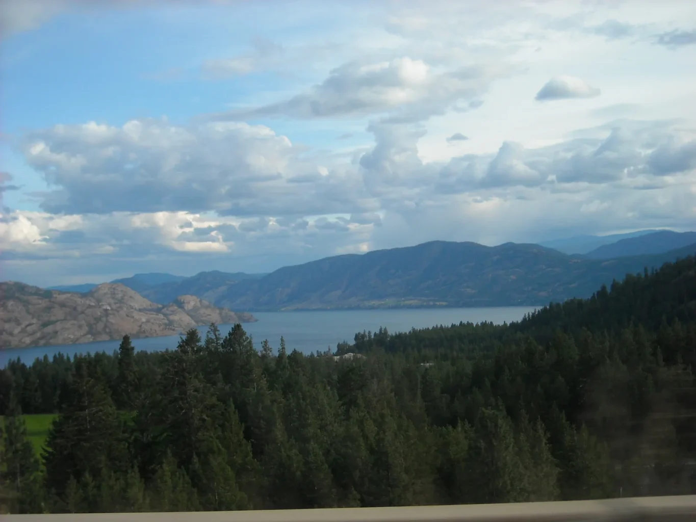 Okanagan Lake surrounded by dry hills near Trepanier, British Columbia.